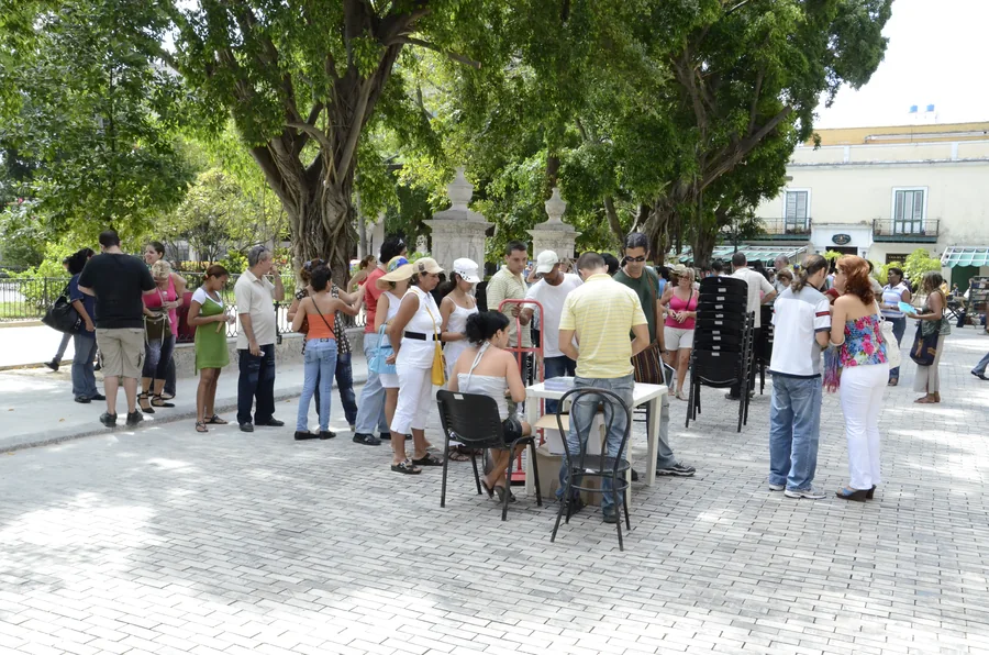 A square with readers queuing at the signing table
