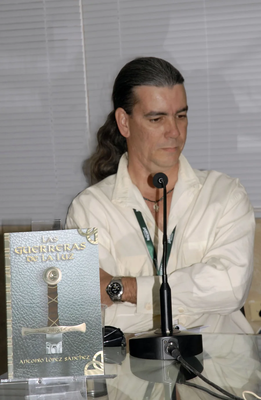 Launch of the book, with a copy on the table in front of the microphone